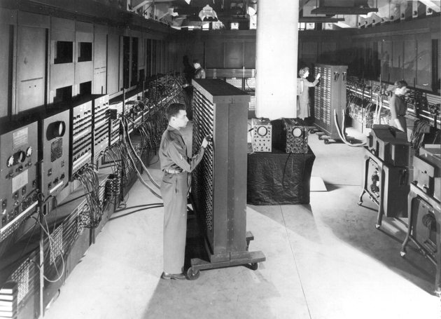 Vintage black and white photo of the ENIAC computer from the mid-20th century
