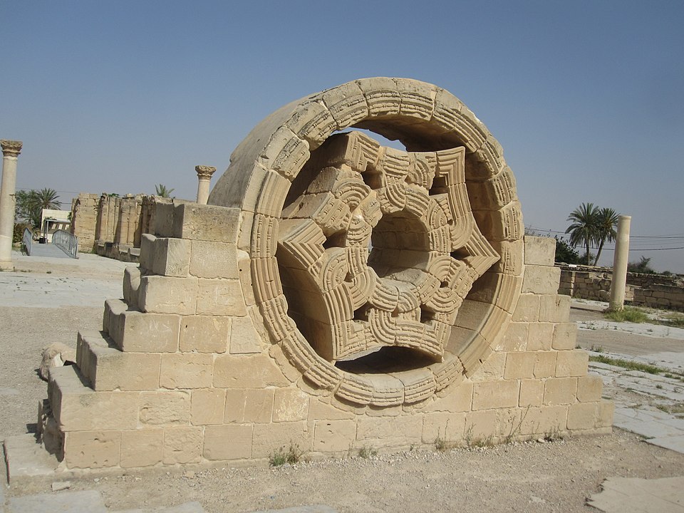 Stone monument featuring a central circle with a six-sided polygon and curved sides, created using geometric techniques with a ruler and compass.